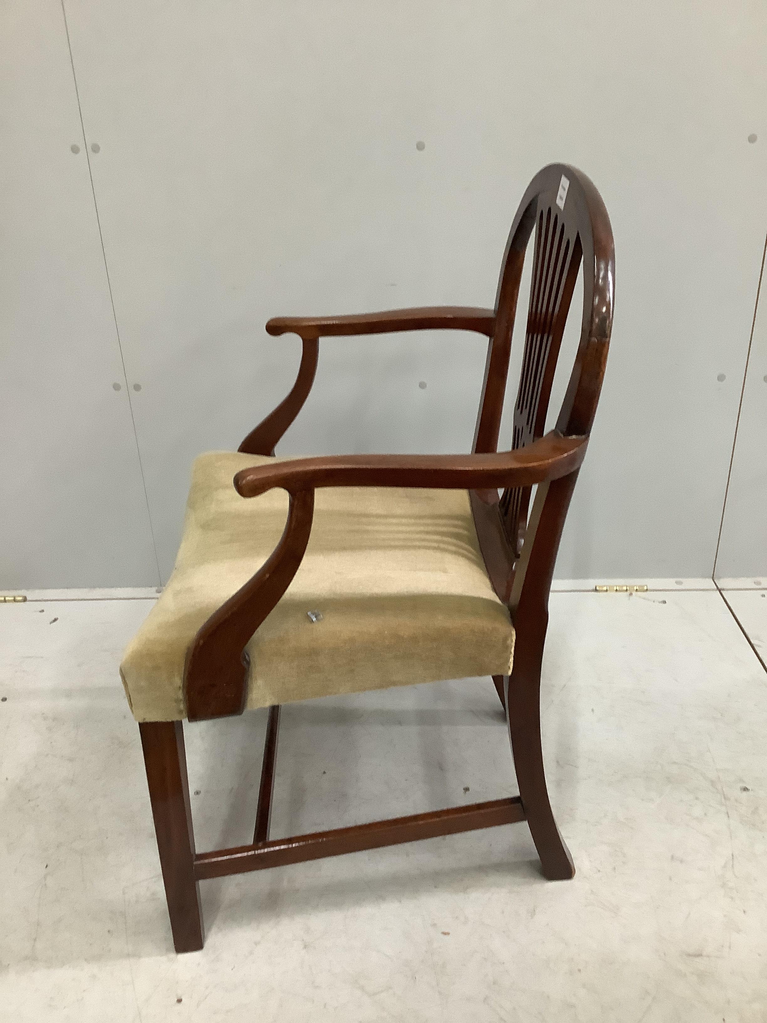 A George III and later mahogany elbow chair, width 61cm, depth 49cm, height 94cm